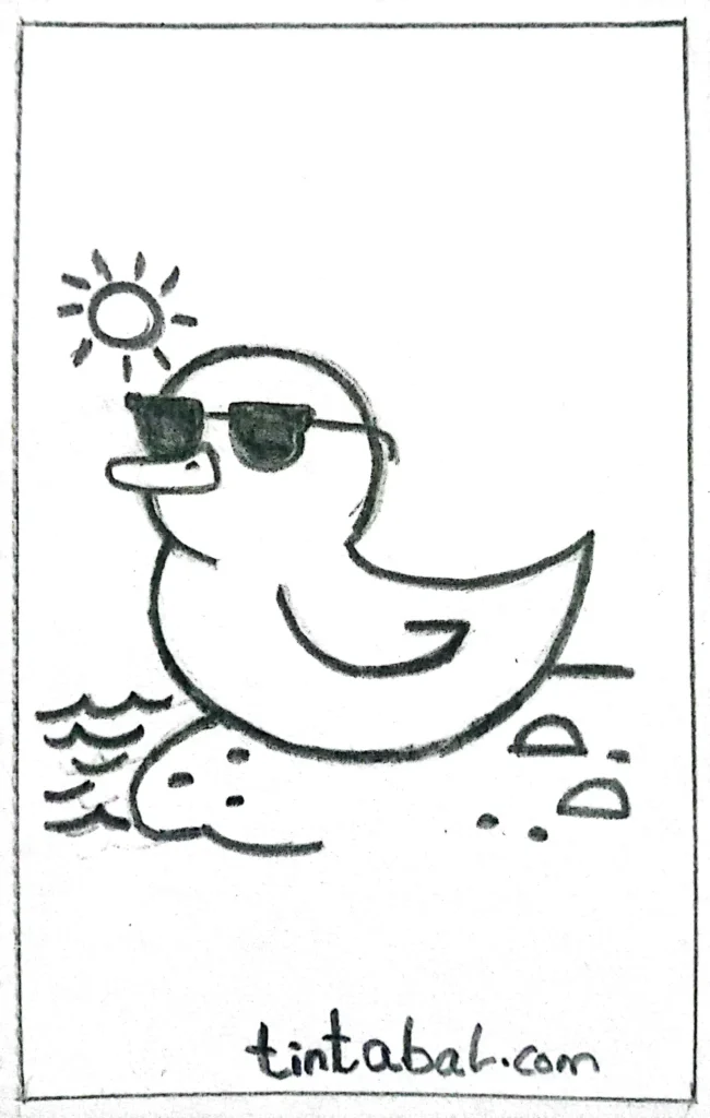 A stylish duck wearing dark sunglasses, posing on a sandy beach with the sea in the background.